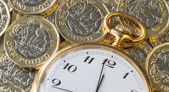 stop watch on top of pounds coins - should you stop paying in to a pension if you have debts?