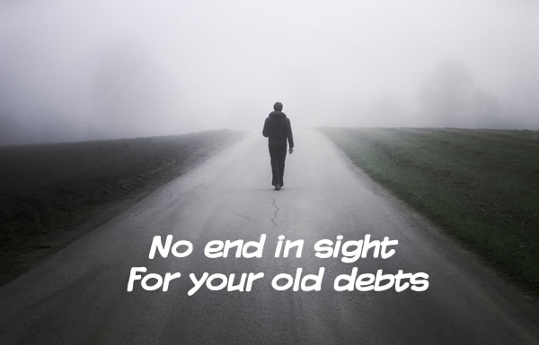Man walking down a long road into the fog, can't see where the road goes - are you paying old debts with no end in sight? with the end 