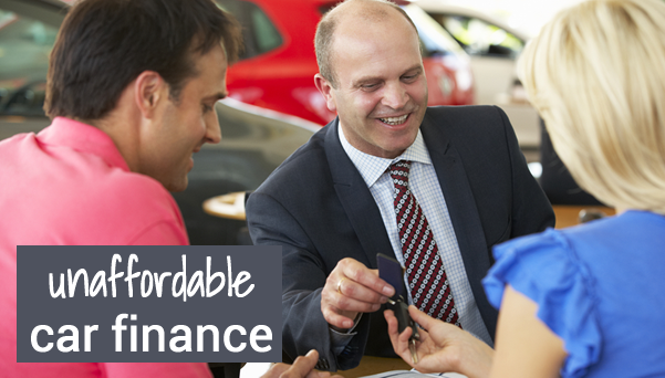 A couple being handed car keys by a salesman. The regulator says not all dealers are checking you can afford the monthly payments - so have you been sold an unaffordable car on finance?