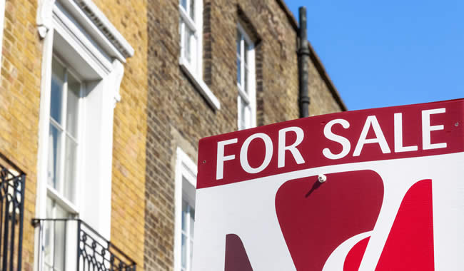 House with a "for sale" board in London - but will it be hard to get a mortgage because of old debts no longer on your credit record?