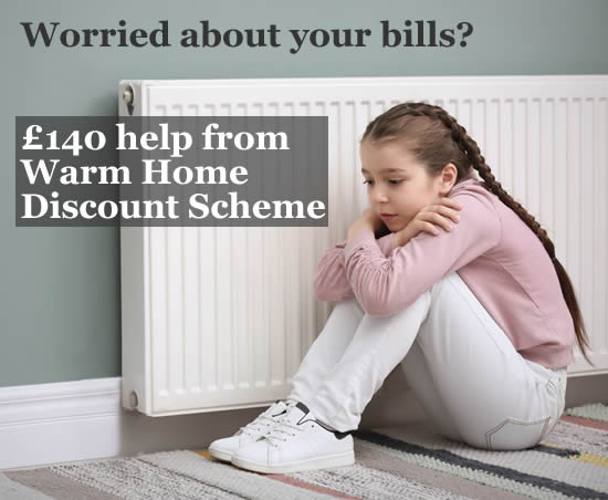 Girl sitting by a radiator because she is cold - if you are worried about your energy bills in winter 2021/22, you may be able to get 3140 help from the Warm Home DIscount Scheme