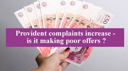 In 2020 Provident is reporting increasing complaints - but is it making low offers to settle them? A hand holds out £50 notes.