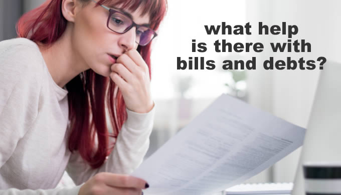 Young woman looking at a bill she can't pay - what help can you get with bills and debts in 2022, when everything has got so expensiveended?