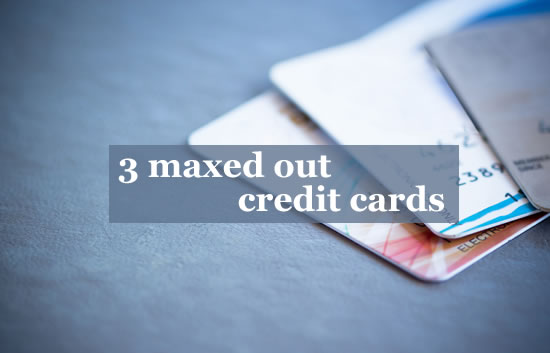 3 credit cards lying on a table - they are all maxed out, so what can you do?