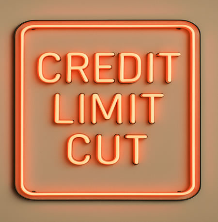 Neon sign saying Credit Limit Cut - recent cuts by Next and Barclaycard