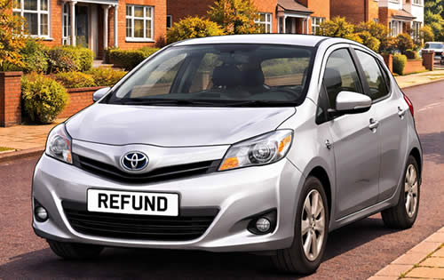 a small hatchback with a number plate saying REFUND